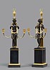 A very fine pair of Directoire gilt and patinated bronze and black marble two-light candelabra attributed to Pierre-Philippe Thomire